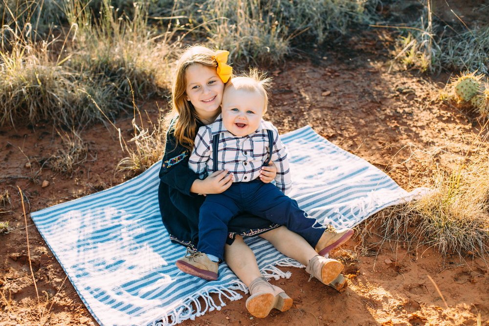  Brother and sister sit on picnic blanket while sister holds brother #tealawardphotography #texasfamilyphotographer #amarillophotographer #amarillofamilyphotographer #lifestylephotography #emotionalphotography #familyphotosoot #family #lovingsiblings #purejoy #familyphotos #familyphotographer #greatoutdoors 