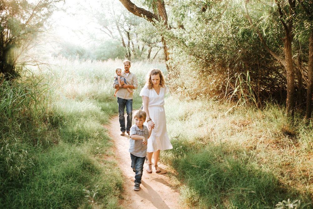  Family walking down the path with sun set behind them and green lush grass surrounding them #tealawardphotography #texassummerphotographer #pictureseason #amarillophotographer #amarillofamilyphotographer #emotionalphotography #engagementphotography #couplesphotography #pickingaseasonforphotosessions #whatsimportant #everythingtogether #pickingcolorsforphotos #summerphotos #greeneryinphotos 