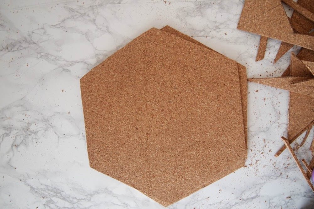 Make hexagon cork boards out of dollar store cork tiles - by The