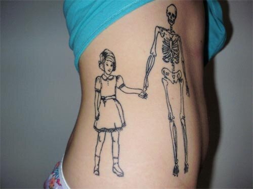 Skeleton with girl tattoo submitted by Caroline