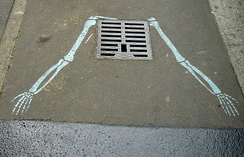 Grate ribcage street art Paris