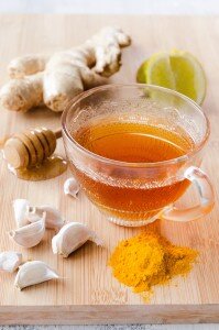 Cup of tea with ginger, lemon, honey, garlic, tumeric for spicy detox drink