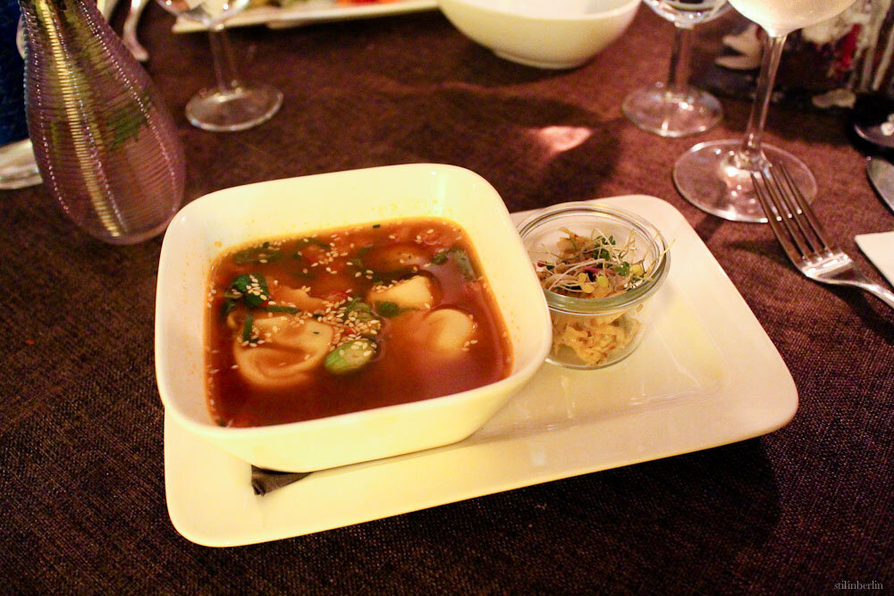 Spicy tart soup with pumpkin dumplings and kimchi, stilinberlin