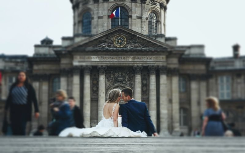 wedding couple sits on footsteps before