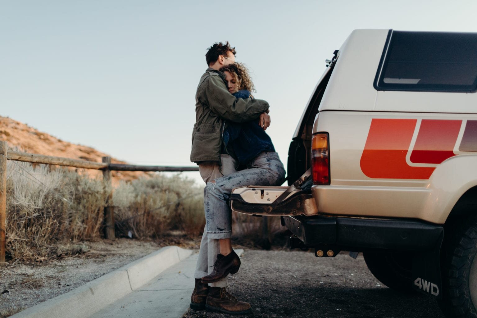 Couple Embracing on tailgate