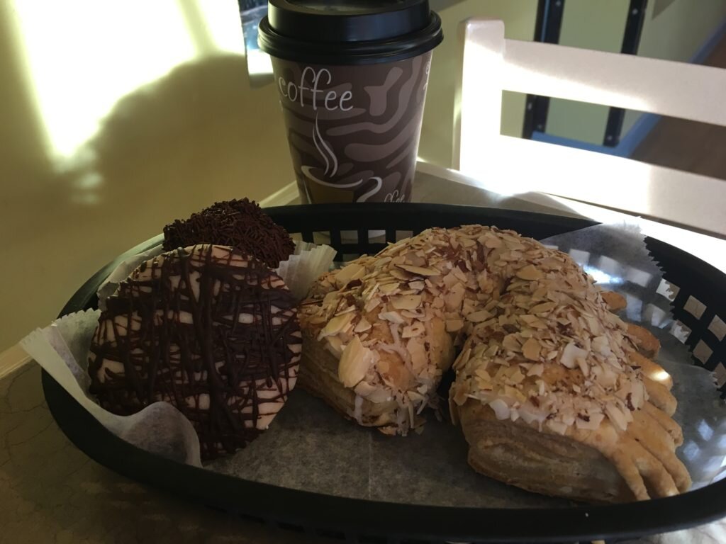 Chocolate rum ball hiding behind the apricot, marzipan cookie and the monstrous almond horn. And an americano :)