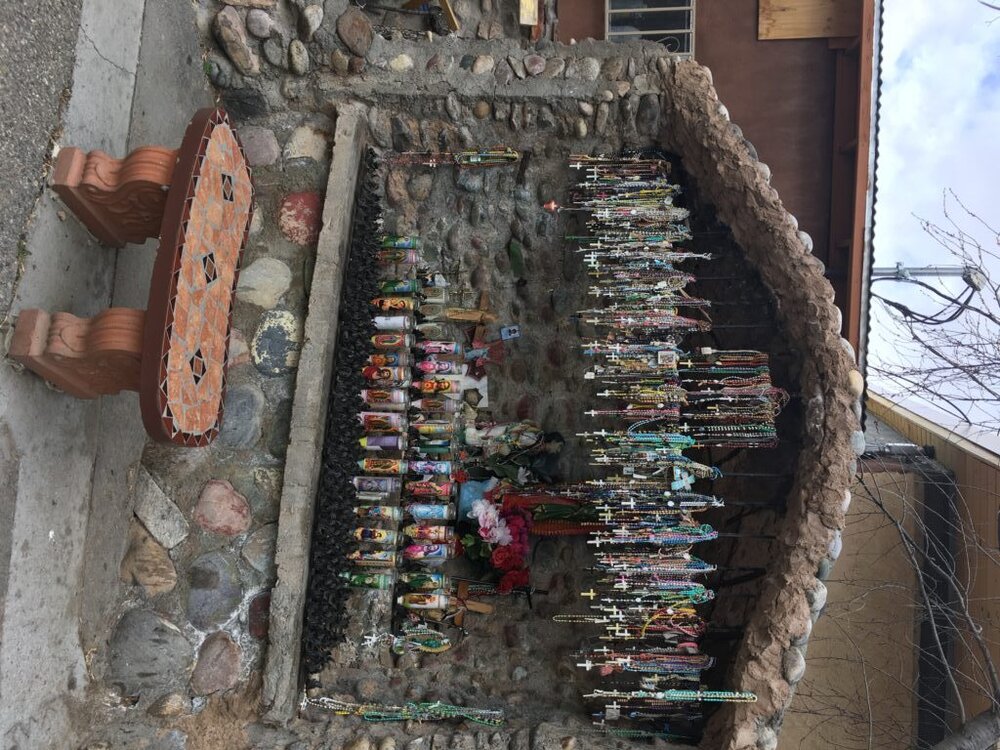 Candles and rosaries left with prayers and hope at Chimayo