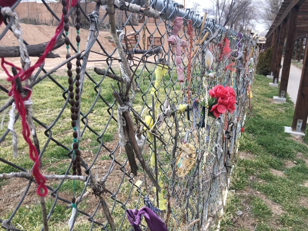 Crosses tied to the fence at Chimayo