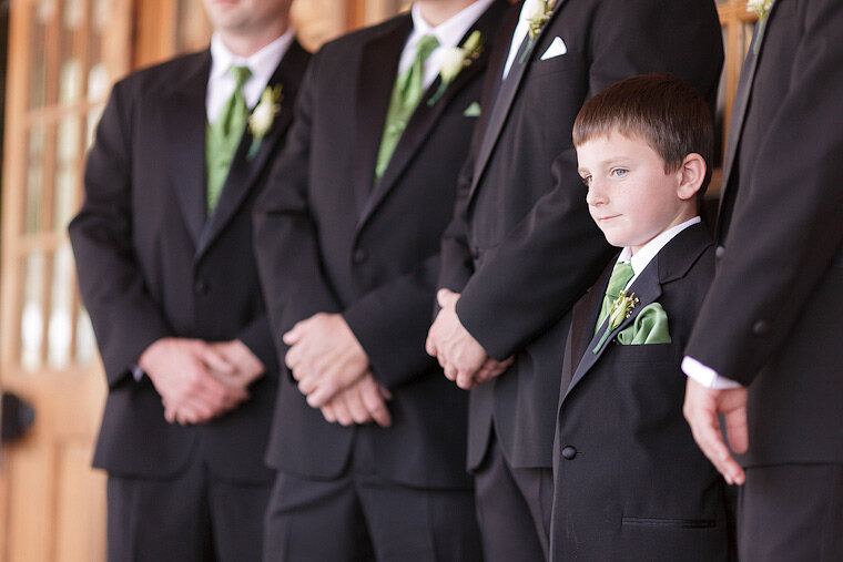 Ring bearer during formal photographs at a wedding.
