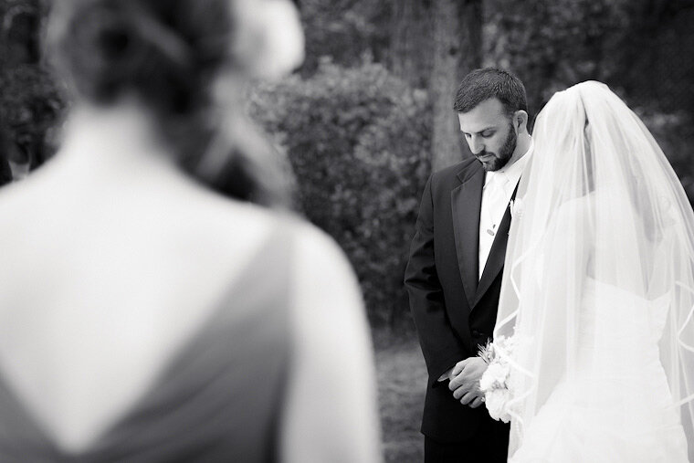 Groom looks pensively at ground during wedding. (I just wanted an excuse to say 