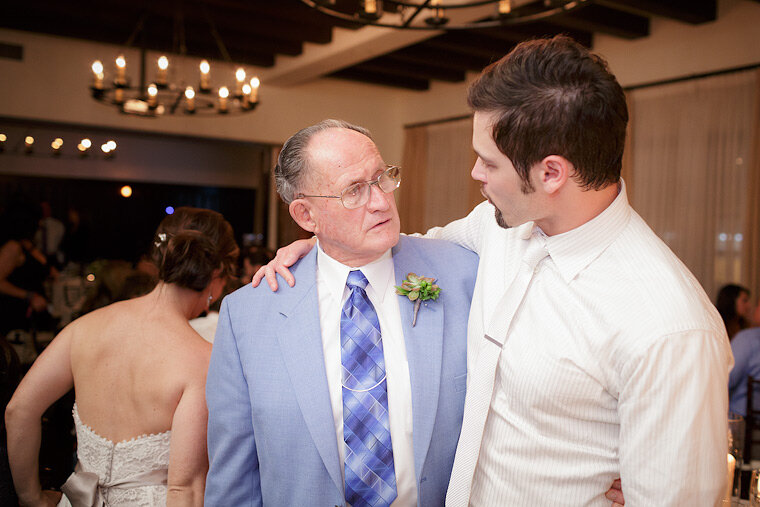 Groom and bride's father exchange a moment.