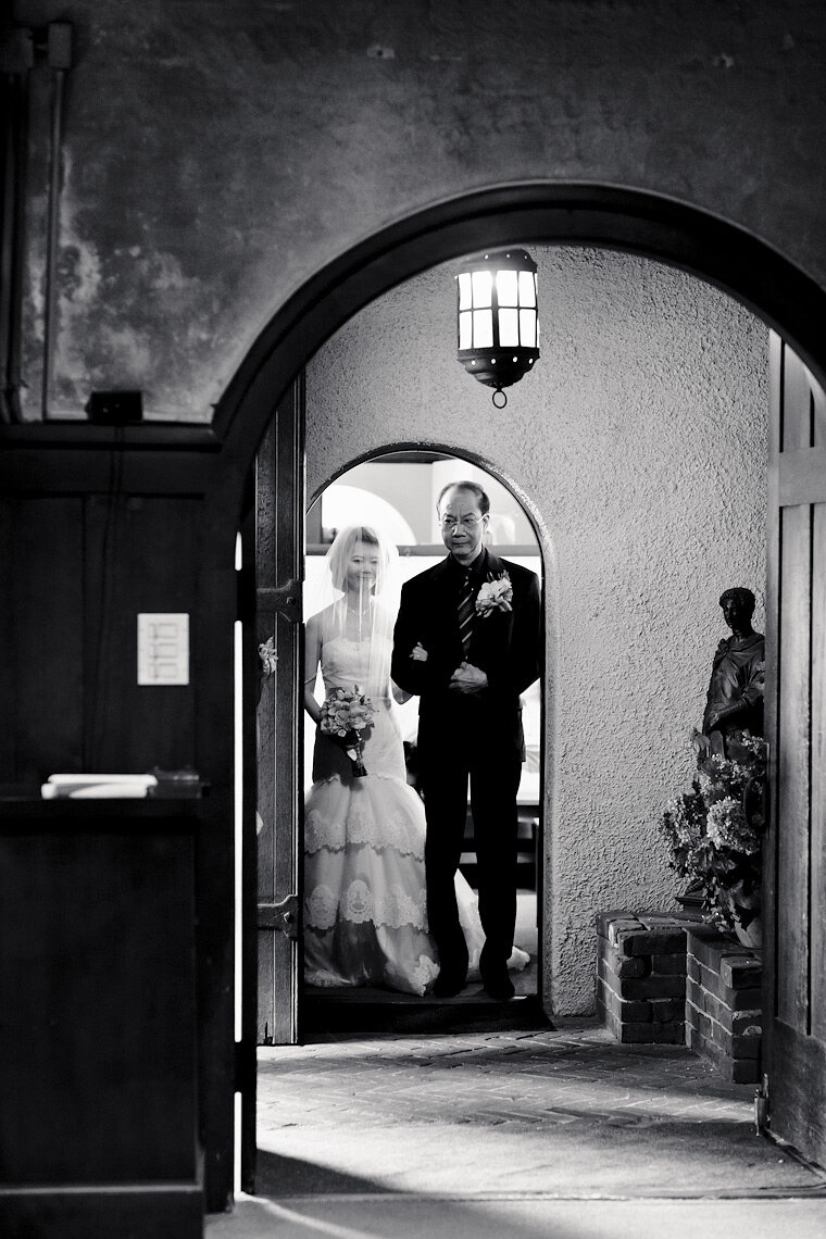 Bride and her father prepare to enter the Swedenborgian Church for her wedding.