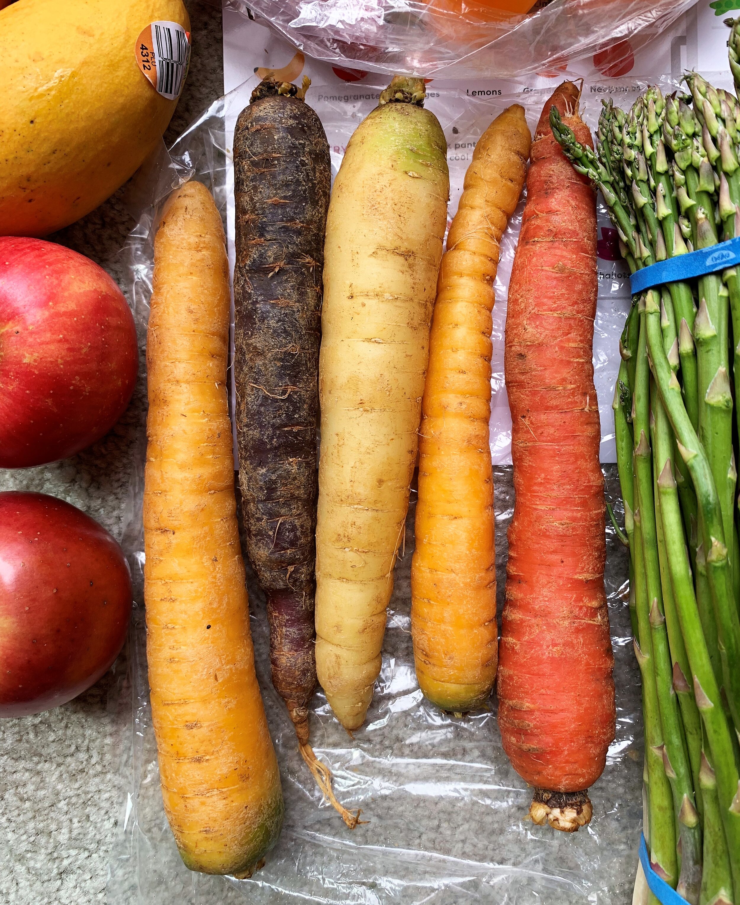 five rainbow carrots of assorted colors from Imperfect Produce