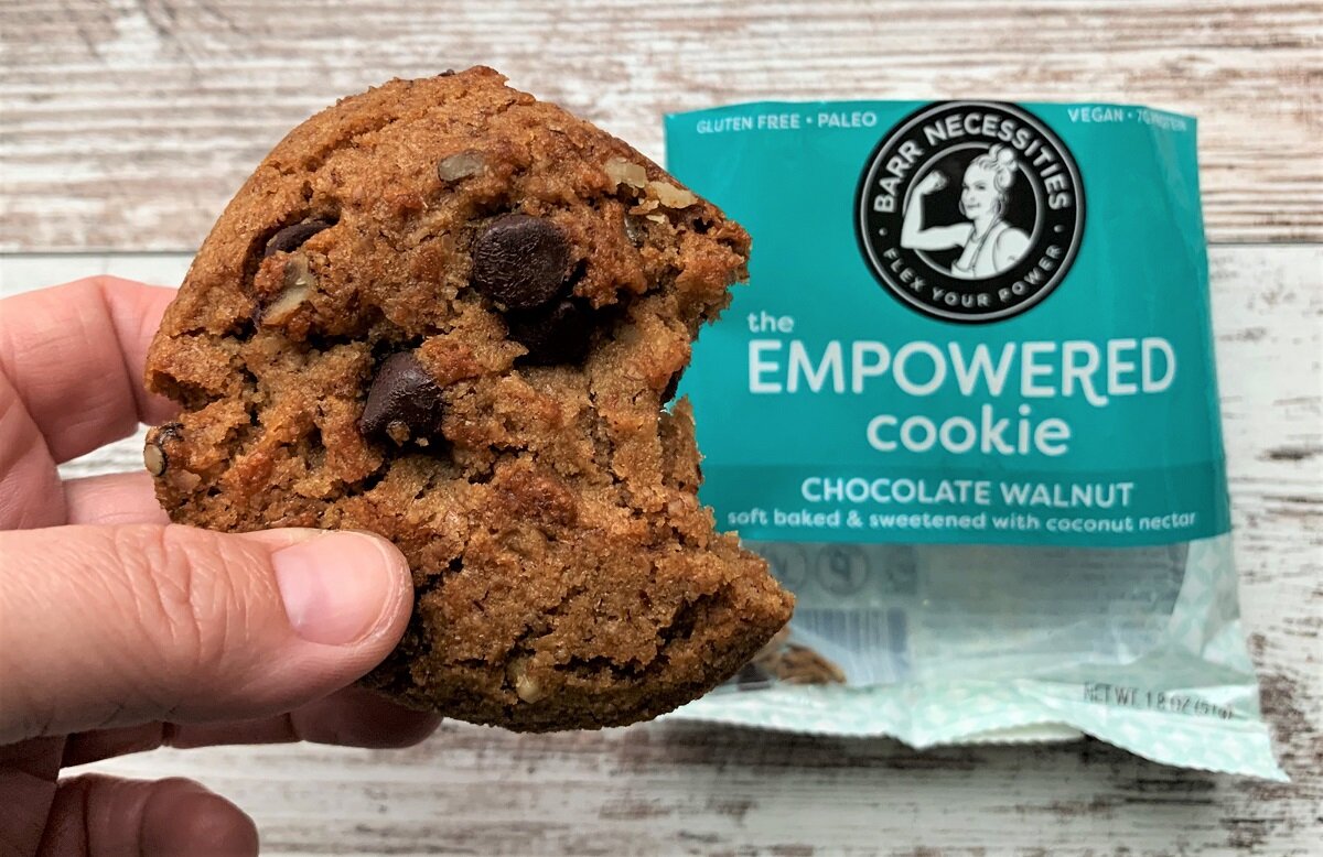 chocolate walnut cookie with Empowered Cookie packaging in the background