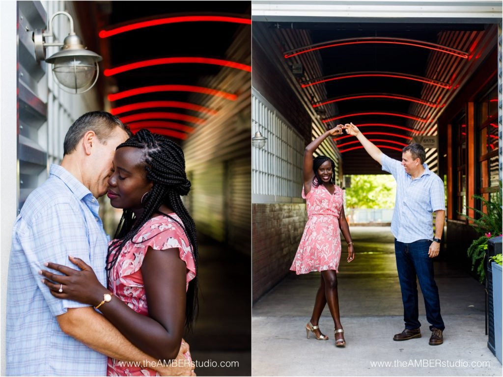 Interracial couple dancing at their engagement session at Trinity Groves in Dallas.