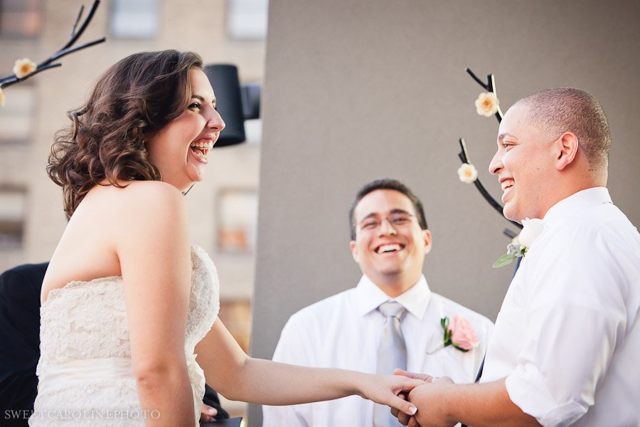 bride and groom smiling during ceremony at la orilla del rio ballroom
