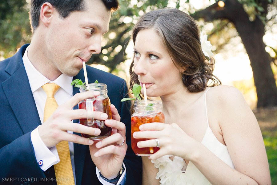 bride and groom drinking tea out of mason jars