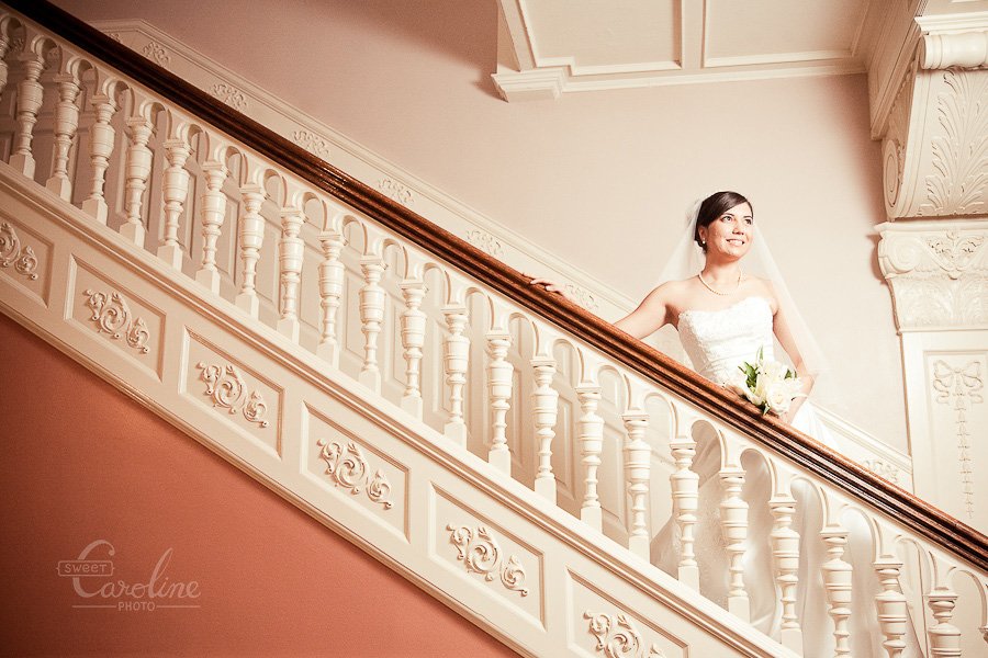 christina on koehler house stair case by Austin wedding photographer Sweet Caroline Photo