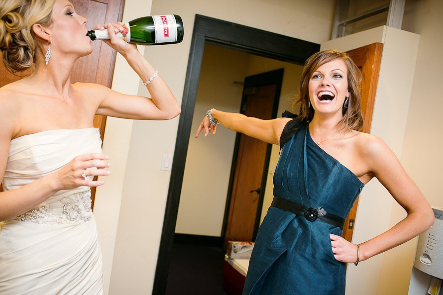 bride drinking champagne before wedding ceremony