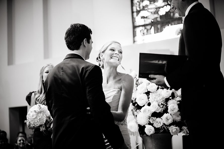 bride laughing before the ceremony kiss
