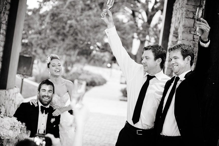 groom's brother's cheering bride and groom