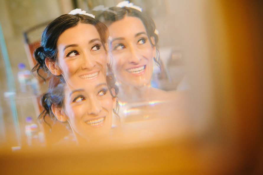 bride smiling while getting ready