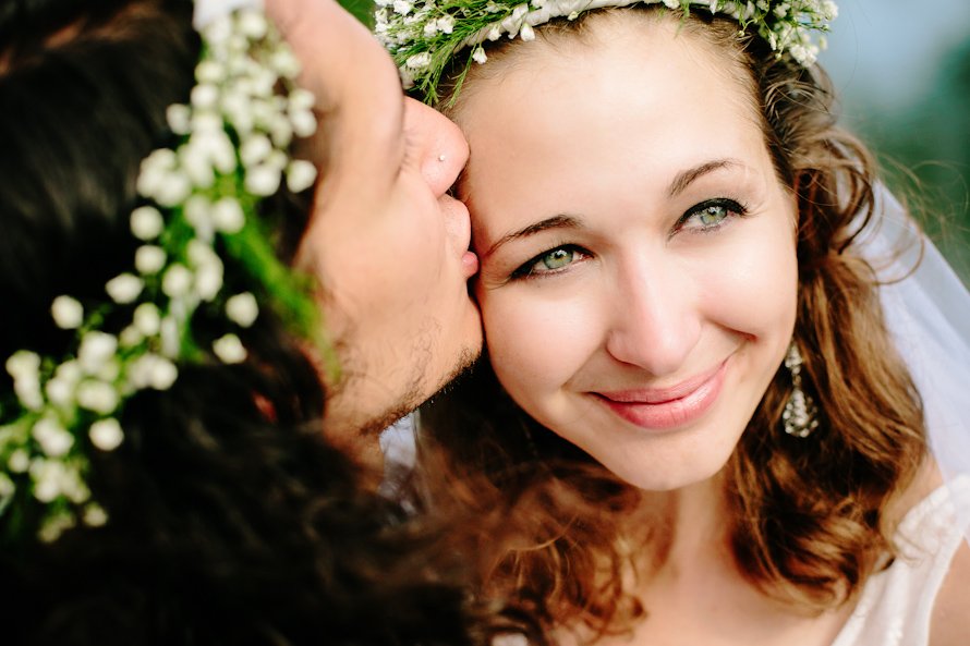 bride and groom wearing head wreathes