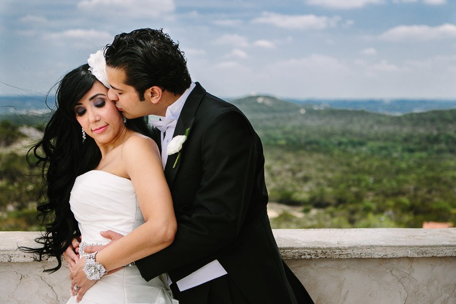 Bride and Groom portrait looking over the austin hill country atop villa antonia