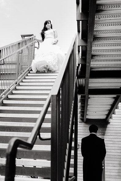 bride walking down the stairs for first look