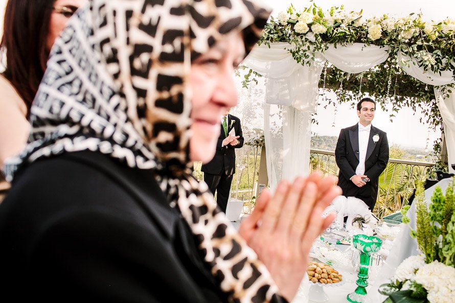 persian mother and her son during the ceremony
