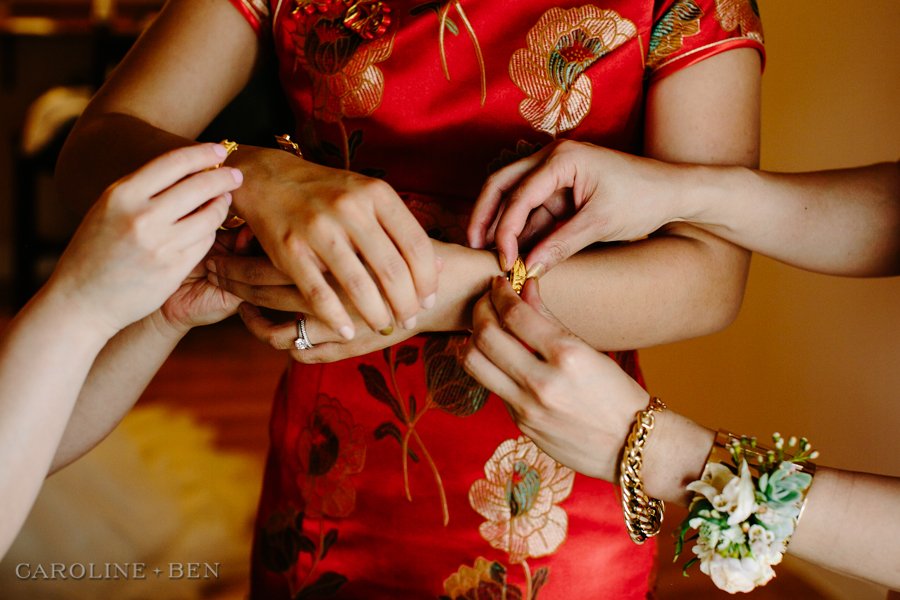 bride getting dressed for Vietnamese tea ceremony