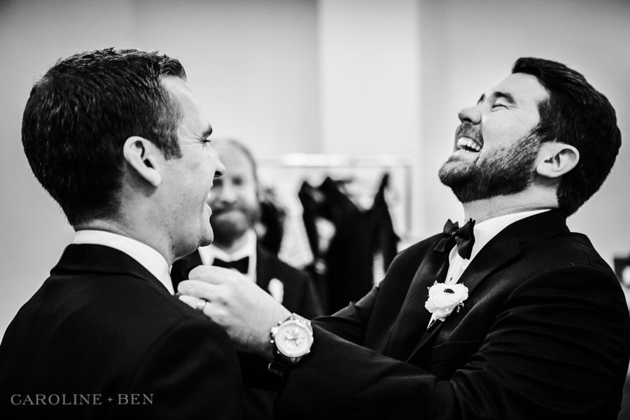 groom and groomsman getting ready
