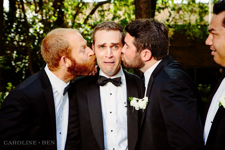 groomsman kissing groom