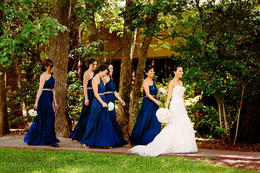 bridesmaids in navy blue with white bouquets