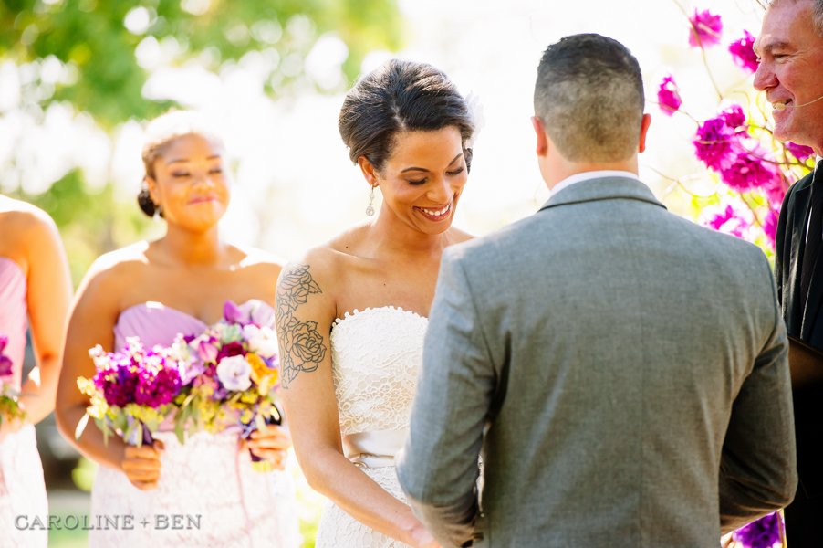 bride smiling during wedding ceremony