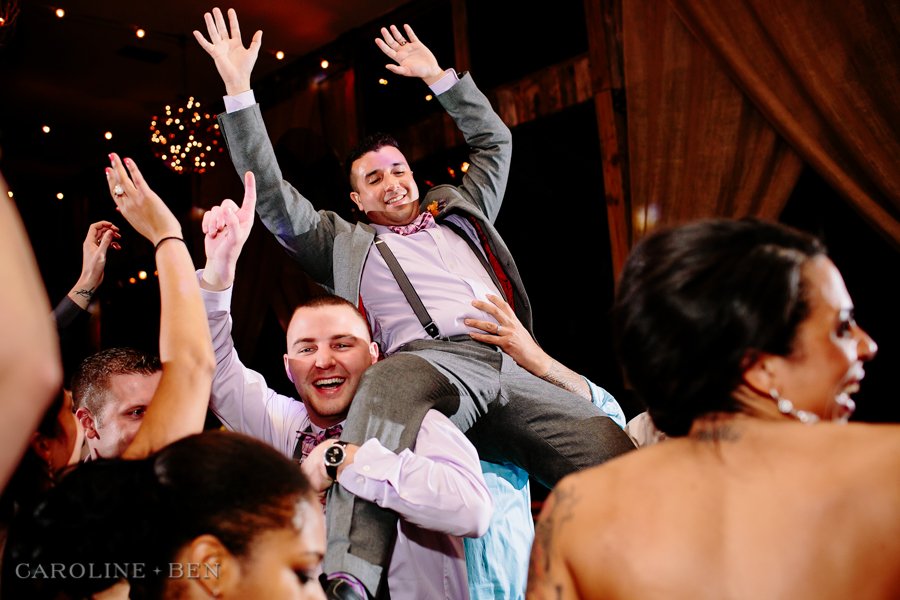 texas wedding guests lifting groom
