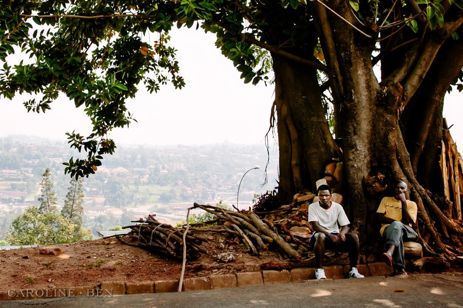 rwandan locals by tree
