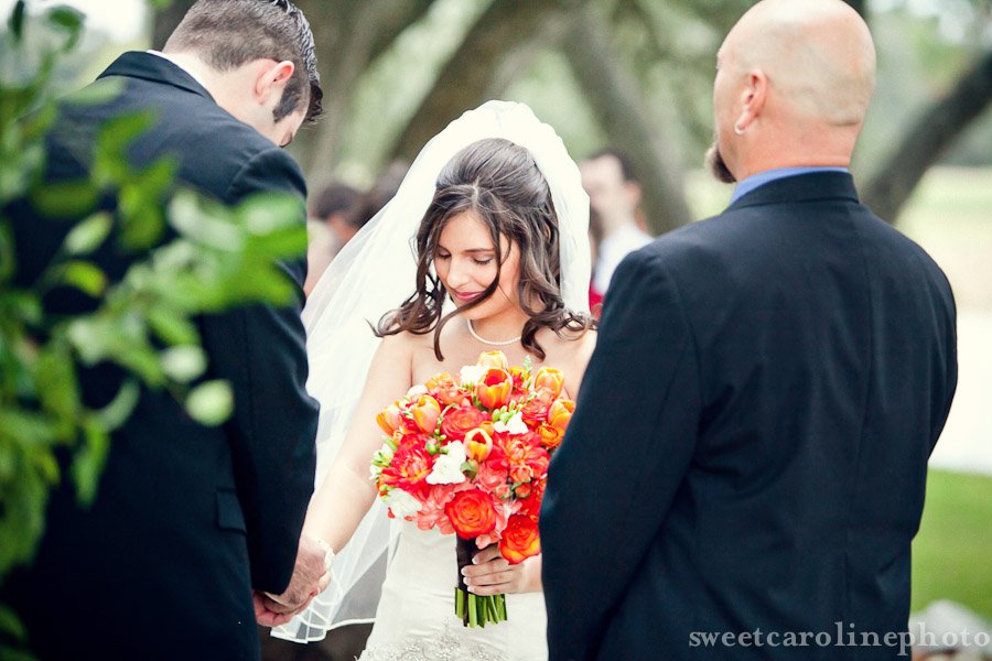 bride and groom praying during ceremony at Houston Oaks Country Club
