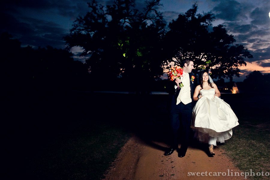bride and groom walking during gorgeous Houston sunset