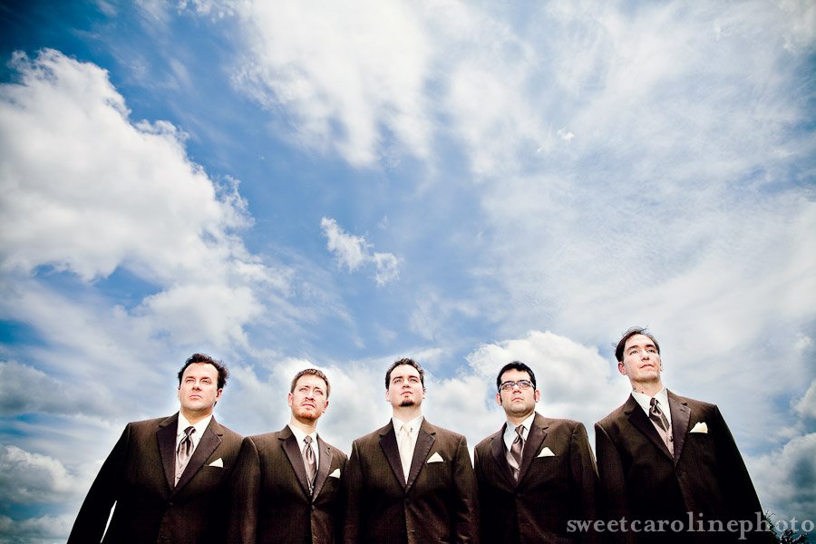 groom and groomsmen with beautiful sky at Star Hill Ranch wedding