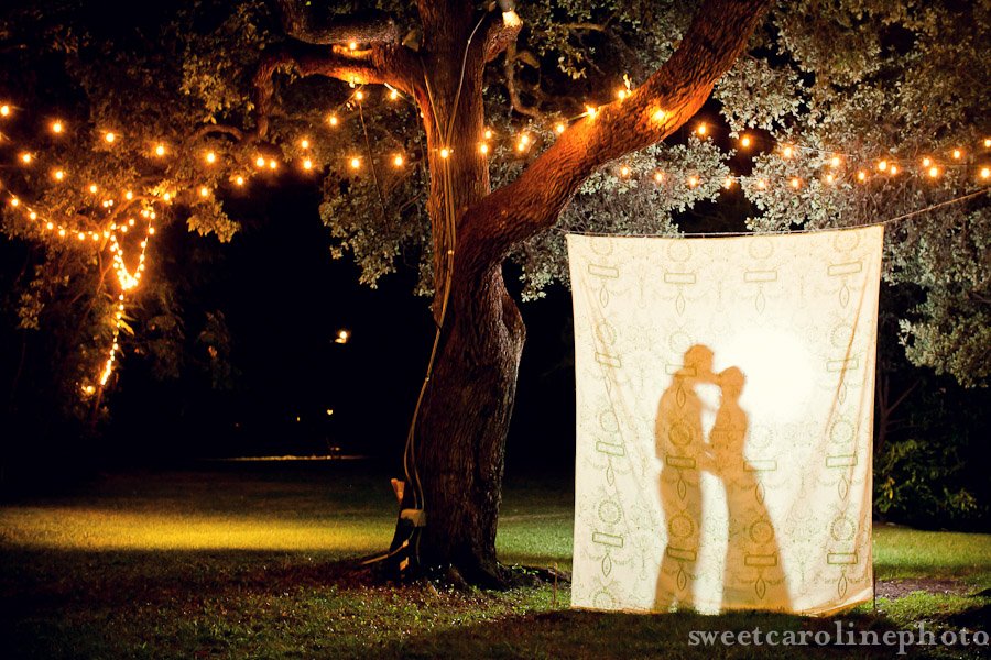 bride and groom kissing silhouette in photobooth at Mercury Hall wedding