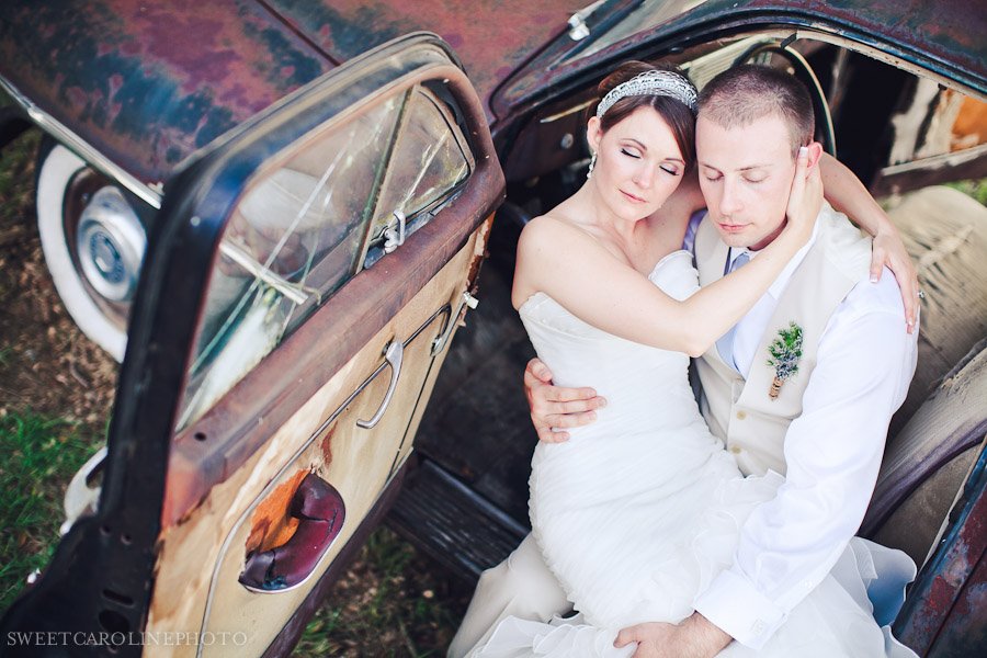 bride and groom sitting in antique car