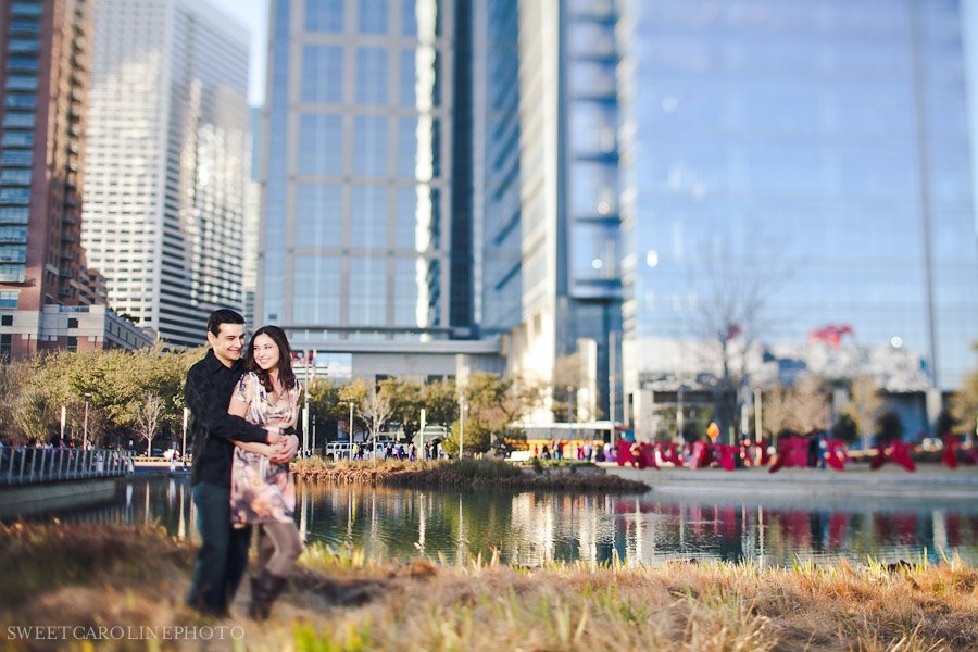 couple standing in front of high rise buildings in Houston