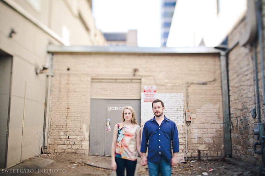 couple standing in downtown Austin alley way