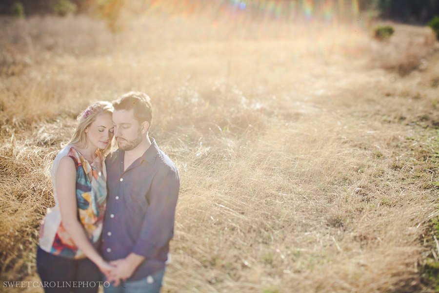 couple in field shot with tilt shift lens
