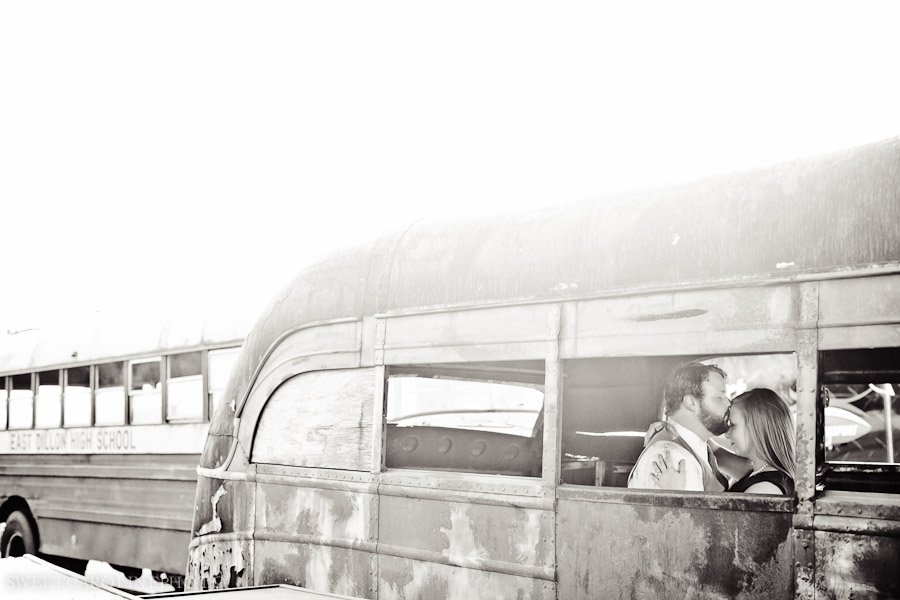engaged couple in abandoned school bus