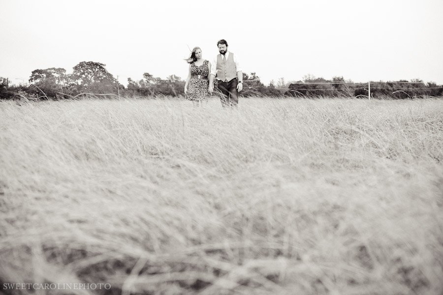 couple walking through field