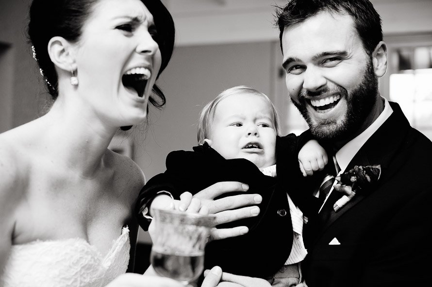 bride and groom and baby