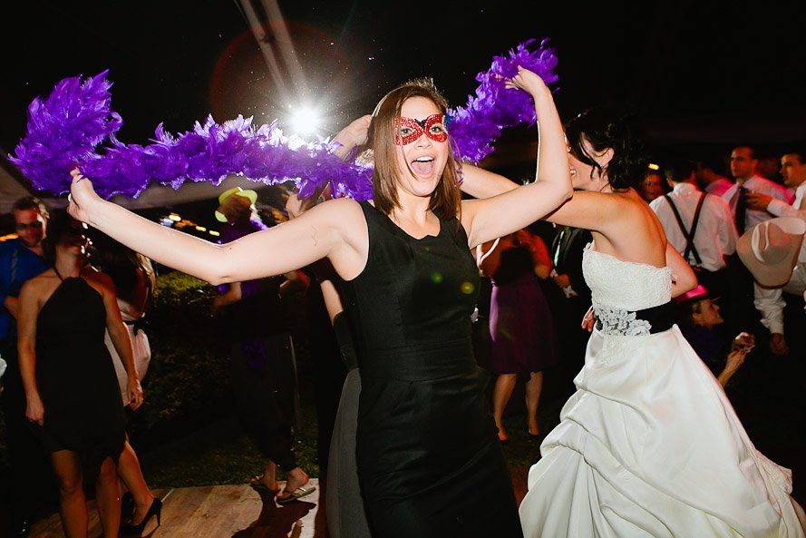 wedding guest dancing the night away with boas