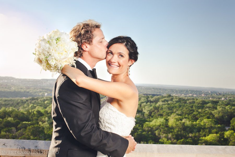 bride and groom with hill country side